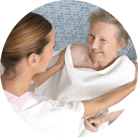 Caregiver assisting elderly women
