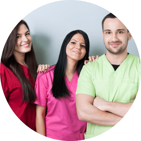 medical or dental team standing and smiling with confidence